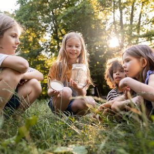 full-shot-kids-sitting-grass