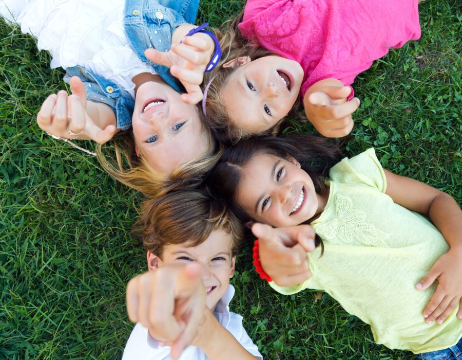 Portrait of group of childrens having fun in the park.